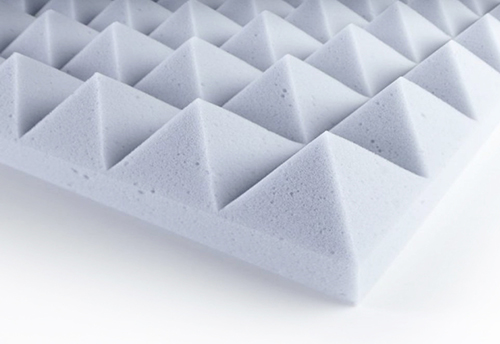 Sound absorbing panels made of synthetic expanded materials